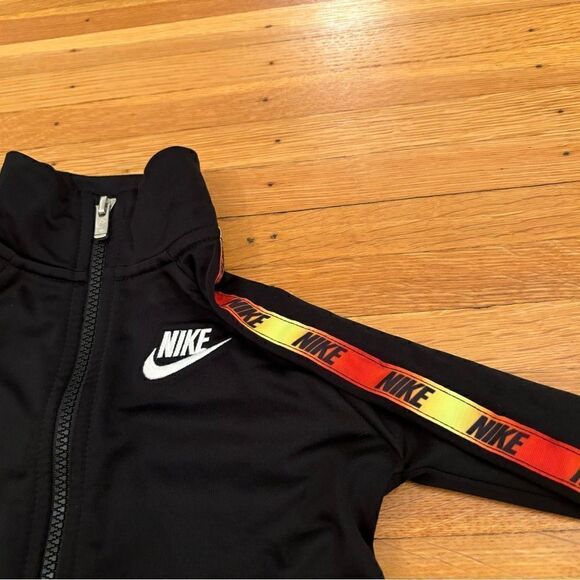 Nike black track zip up jacket with orange/yellow stripe down arms - Picture 4 of 5
